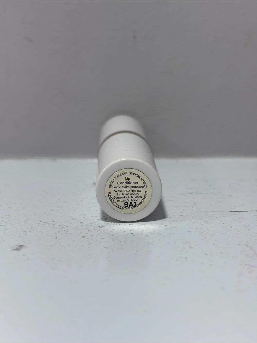 Estée Lauder Lip Conditioner Lipstick .13 Fl Oz - White Tube with Gold Accent